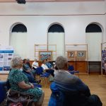 Audience listening to storytellers