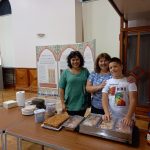 Three people ready to serve lunch